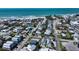 Aerial view showcases a coastal home, neighborhood, and proximity to the beach at 5007 2Nd Ave, Holmes Beach, FL 34217