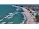 Sweeping beach view filled with people and calm ocean waves along the sandy shoreline at 5007 2Nd Ave, Holmes Beach, FL 34217