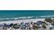 Stunning aerial view of the beach with ocean waves and nearby houses in the neighborhood at 5007 2Nd Ave, Holmes Beach, FL 34217