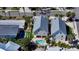 Aerial view of the home showcasing the pool, landscaped backyard, and proximity to neighboring properties at 5007 2Nd Ave, Holmes Beach, FL 34217