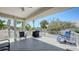 Relaxing covered balcony with grill and seating offering a pleasant outdoor living space at 5007 2Nd Ave, Holmes Beach, FL 34217