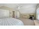 Upstairs bedroom featuring carpet, ample natural light, and stylish decor at 5007 2Nd Ave, Holmes Beach, FL 34217