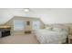 Upstairs bedroom featuring carpet, ample natural light, and stylish decor at 5007 2Nd Ave, Holmes Beach, FL 34217