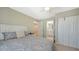 Comfortable bedroom with light carpet, a closet, and an ensuite bathroom at 5007 2Nd Ave, Holmes Beach, FL 34217