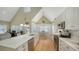 Modern open-concept kitchen with white cabinetry, an eat-in kitchen, and stainless steel appliances at 5007 2Nd Ave, Holmes Beach, FL 34217