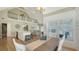 Bright living area featuring an open floor plan, white island kitchen, and view of the upper level loft at 5007 2Nd Ave, Holmes Beach, FL 34217