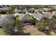 Aerial view showcases the home's backyard, screened lanai, and well-maintained landscaping at 5011 Kincaid Park Ln, Bradenton, FL 34211