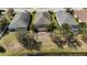 The home's screened patio, and landscaping are showcased in this aerial view at 5011 Kincaid Park Ln, Bradenton, FL 34211