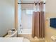 Neat bathroom featuring a shower-tub combination, toilet, and towel rack at 5011 Kincaid Park Ln, Bradenton, FL 34211