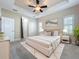 An elegant bedroom features a tray ceiling, plush carpet, and stylish decor for a cozy retreat at 5011 Kincaid Park Ln, Bradenton, FL 34211