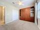 Bedroom featuring a stylish built-in Murphy bed, closet and shelves, maximizing space and organization at 5011 Kincaid Park Ln, Bradenton, FL 34211
