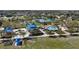 Aerial view of community amenities including a splash park, playground, picnic pavilions, and tennis courts at 5011 Kincaid Park Ln, Bradenton, FL 34211