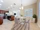 Bright dining area adjacent to the kitchen with stylish decor and natural light at 5011 Kincaid Park Ln, Bradenton, FL 34211