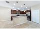 Charming kitchen featuring a center island, stainless appliances, and elegant granite countertops at 5011 Kincaid Park Ln, Bradenton, FL 34211