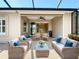 Enjoy the outdoors on this charming patio with comfortable seating and a retractable screen at 5011 Kincaid Park Ln, Bradenton, FL 34211