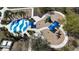 Charming aerial view of the splash park, playground, and surrounding landscaping at 5011 Kincaid Park Ln, Bradenton, FL 34211