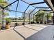 This large screened patio allows you to enjoy views of the lake and backyard at 5011 Kincaid Park Ln, Bradenton, FL 34211