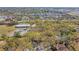 Aerial shot capturing the residential neighborhood, green spaces, and a glimpse of the tranquil bay at 5117 27Th W St # 5117, Bradenton, FL 34207