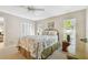 Cozy bedroom featuring coastal-themed decor, carpet floors, and a large window at 5117 27Th W St # 5117, Bradenton, FL 34207