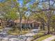 Charming single-story home with lush landscaping and a convenient carport nestled beneath mature shade trees at 5117 27Th W St # 5117, Bradenton, FL 34207