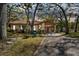Charming single-story home featuring a carport, neutral paint, mature trees, and well-manicured landscaping at 5117 27Th W St # 5117, Bradenton, FL 34207