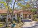 Charming home featuring a covered carport, mature trees, and well-maintained landscaping in the front yard at 5117 27Th W St # 5117, Bradenton, FL 34207