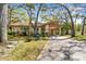 Charming single-story home featuring a carport, neutral paint, mature trees, and well-manicured landscaping at 5117 27Th W St # 5117, Bradenton, FL 34207