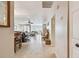 Hallway view to living area boasts tile flooring, neutral paint, and welcoming natural light at 5117 27Th W St # 5117, Bradenton, FL 34207