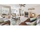 Inviting living room features comfortable leather sofas, tile flooring, and stylish decor throughout at 5117 27Th W St # 5117, Bradenton, FL 34207