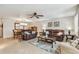 Spacious living room with tile flooring, comfortable sofas, and adjacent dining area for entertaining at 5117 27Th W St # 5117, Bradenton, FL 34207