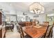 Spacious open-concept living and dining area featuring tile flooring and lots of natural light from the windows at 5117 27Th W St # 5117, Bradenton, FL 34207