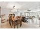 Open-concept living and dining area showcasing tiled floors, comfortable seating and bright overhead lighting at 5117 27Th W St # 5117, Bradenton, FL 34207