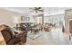 Cozy living room with comfortable leather seating and lots of bright natural light and open to the dining room at 5117 27Th W St # 5117, Bradenton, FL 34207