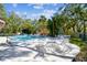 Relaxing community pool area surrounded by lush greenery and comfortable lounge chairs at 5117 27Th W St # 5117, Bradenton, FL 34207