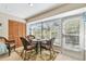 Cozy sun room featuring wicker furniture, ample natural light, and access to the outdoors at 5117 27Th W St # 5117, Bradenton, FL 34207