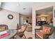 Sunlit sitting area features wicker chairs, decorative rug, and views to the main living space at 5117 27Th W St # 5117, Bradenton, FL 34207