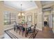 Traditional dining room with hardwood floors, chandelier lighting, and a large window with natural light at 519 Habitat Blvd, Osprey, FL 34229