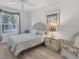 Cozy bedroom with a wicker bed frame and soft neutral tones at 5240 Hyland Hills Ave # 1426, Sarasota, FL 34241