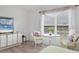 Serene bedroom with a seating area, natural light, and a peaceful ambiance for relaxation and comfort at 5240 Hyland Hills Ave # 1426, Sarasota, FL 34241