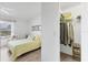 Well-lit bedroom featuring a closet, comfortable bed, and sunny seating area, creating a cozy and inviting space at 5240 Hyland Hills Ave # 1426, Sarasota, FL 34241