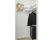Well-organized closet with shelves, hanging space, and luggage at 5240 Hyland Hills Ave # 1426, Sarasota, FL 34241