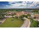 Aerial view of the impressive clubhouse at Heritage Oaks Golf & Country Club at 5240 Hyland Hills Ave # 1426, Sarasota, FL 34241