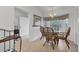 Cozy dining area with natural light from the large windows, creating a welcoming atmosphere by the entrance at 5240 Hyland Hills Ave # 1426, Sarasota, FL 34241