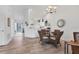 Bright dining area with stylish chandelier and seating for four at 5240 Hyland Hills Ave # 1426, Sarasota, FL 34241