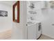 Laundry room featuring modern washer and dryer and shelving for storage at 5240 Hyland Hills Ave # 1426, Sarasota, FL 34241