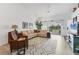 Bright living room with neutral decor and sliding glass doors to the outdoors at 5240 Hyland Hills Ave # 1426, Sarasota, FL 34241