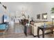 Spacious living area with hardwood floors, open to kitchen and dining area at 5240 Hyland Hills Ave # 1426, Sarasota, FL 34241