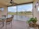 Relaxing screened-in patio with views of the lake and golf course at 5240 Hyland Hills Ave # 1426, Sarasota, FL 34241