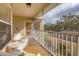 Relaxing screened-in porch with comfortable seating and a tranquil view at 5240 Hyland Hills Ave # 1426, Sarasota, FL 34241