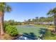 Enjoy a community basketball court, perfect for outdoor fun and recreation with lush landscaping and tropical trees at 5744 Woodland Sage Dr, Sarasota, FL 34238